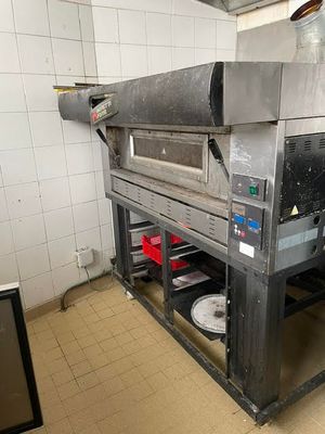 an image of a commercial pizza oven in a kitchen