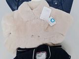 three pieces of clothing sitting on top of each other on a table