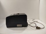 a small black box with a cord attached to it