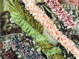 a close up of a piece of fabric with flowers and butterflies on it