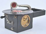an old record player sitting on top of a table
