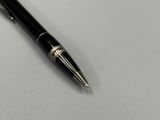 a pen that is laying on top of a table