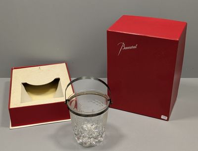 a red box and a glass of water next to a red box