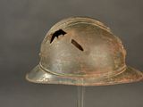 a helmet with a bird on it on a stand