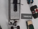 many toy cars and trucks on display on a table
