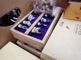 a box with a bunch of small figurines inside of it