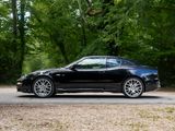 a black sports car that is parked on the side of the road