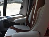 a view of the inside of a van with the driver ' s seat up
