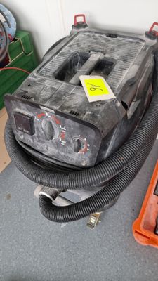 a black and gray machine sitting on top of a table