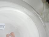 a close up of a person ' s hand in a bowl