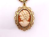 an image of a necklace with a picture of a woman on it