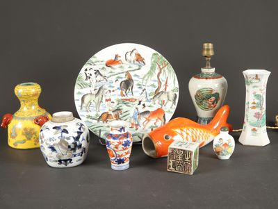 many different vases and a plate on the table