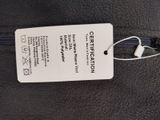 a tag on the back of a jacket that is attached to it