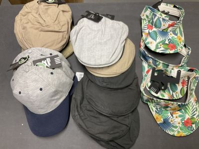 many hats that are sitting on a table
