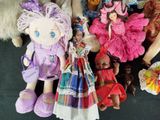 a lot of dolls that are sitting on a table
