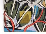a picture of a cross stitch picture on a wall