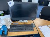 a desktop computer sitting on a desk with a keyboard and mouse