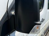 an image of a side view mirror of a van