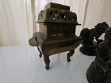 a small statue of a man and a horse on a table