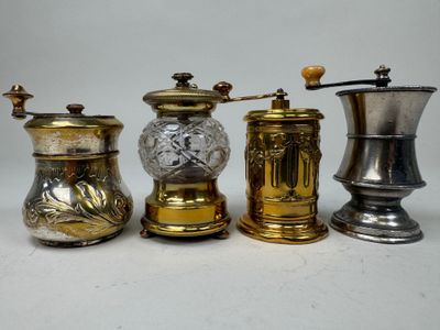 three different types of coffee grinders are lined up on a table