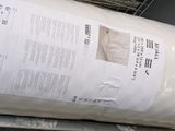 a roll of paper sitting on top of a metal rack