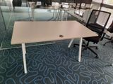tables and chairs in an office with glass walls and blue carpet
