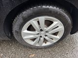 a black car that has a flat tire on it
