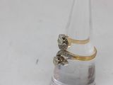 silver and gold plated ring with flower design on top