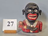 a small statue of a man with a number 27 on it