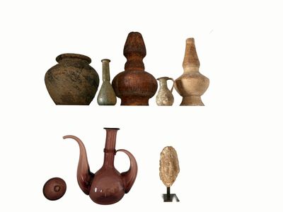 many different types of vases displayed on a shelf