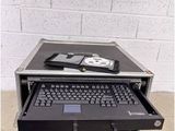 a laptop computer sitting on top of a hard case