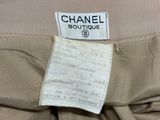 the label on the back of a chanel dress is clearly visible