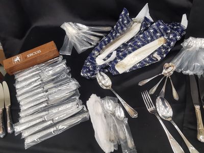 a table with silverware and silverware on it
