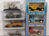 a lot of toy cars and trucks in a display case
