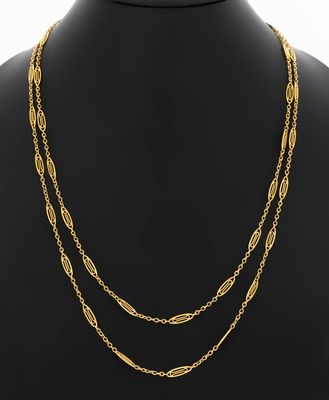 a gold plated necklace with three strands of chain