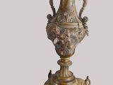 a vase on a stand with a base on it