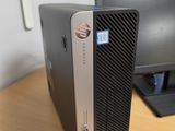 a desktop computer sitting on a desk next to a computer monitor