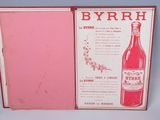 a pink box with a bottle of wine inside of it