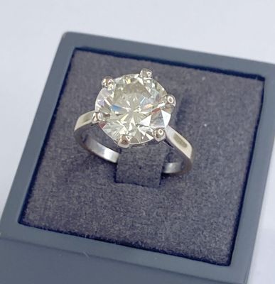 an image of a diamond ring in a box on a table