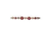 a close up of a gold plated hair clip with pink stones