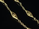 a pair of gold plated chain with a diamond cut design