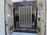 a white van with the door open and the back door open