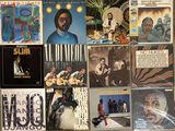many different records on the wall in this room