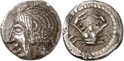 a silver coin with an image of a woman and a man on it