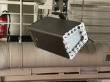 a box that is sitting on top of a metal pipe