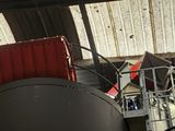 a large jet sitting in the middle of a hangar