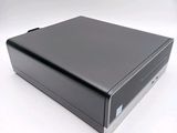 an image of a small black computer on a white surface