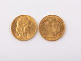 two pieces of gold coins with a woman on one side and a man on the other side