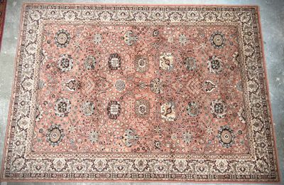 an antique persian rug on the floor in a room