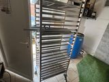 a metal rack that has a bunch of food on it